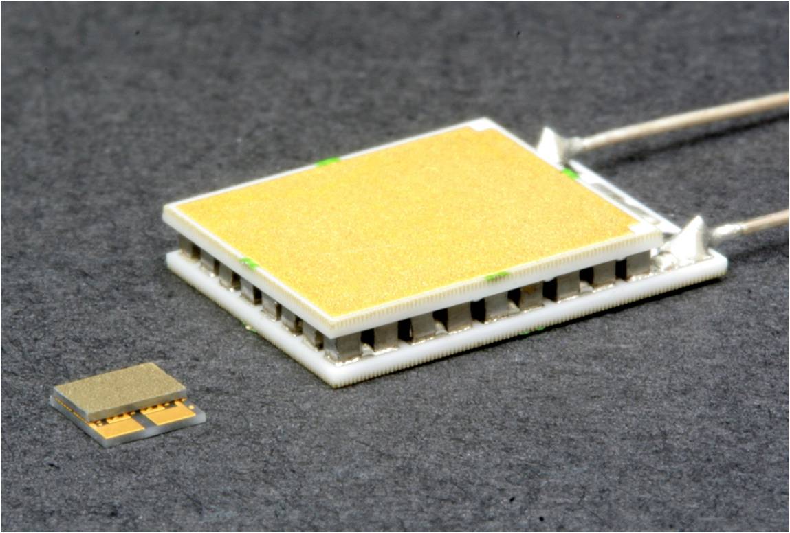 Figure 2: Size comparison between two 6W thermoelectric modules. A Laird-Nextreme thin-film module is on the left, with a bulk thermoelectric module on the right.